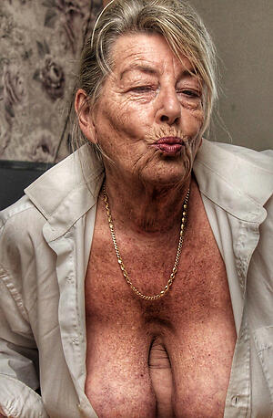 60 year ancient woman poses minimal