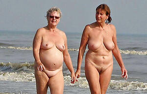 morose older woman on beach show off